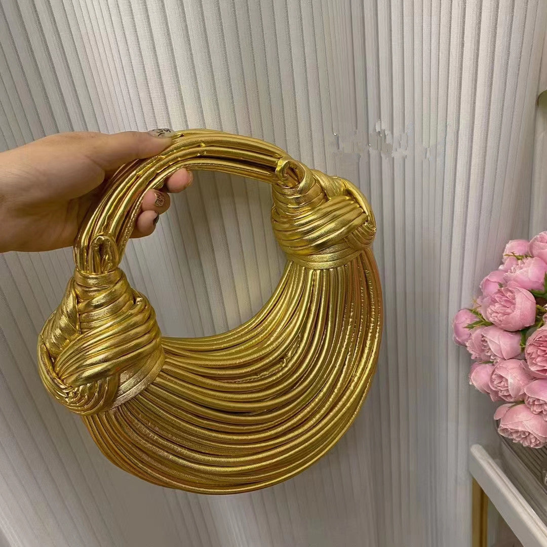 Amelia · Bolso dorado de nudos – Silvia Morel