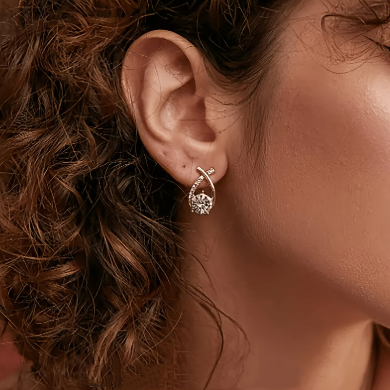 Iris · Pendientes de cruz con circonitas – Silvia Morel