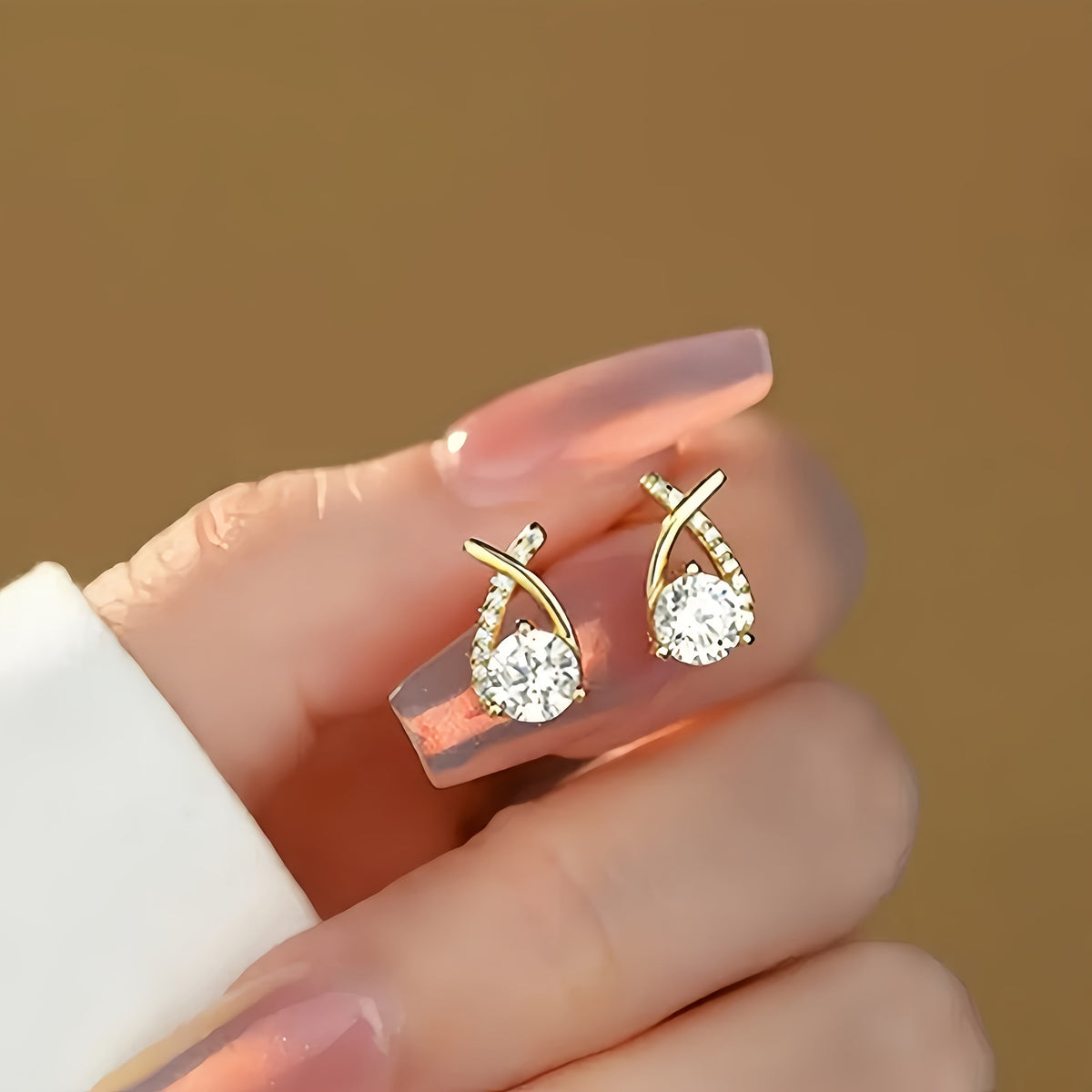 Iris · Pendientes de cruz con circonitas – Silvia Morel