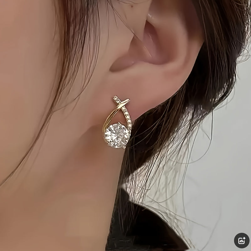 Iris · Pendientes de cruz con circonitas – Silvia Morel