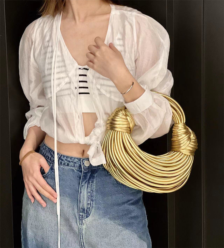 Amelia · Bolso dorado de nudos – Silvia Morel