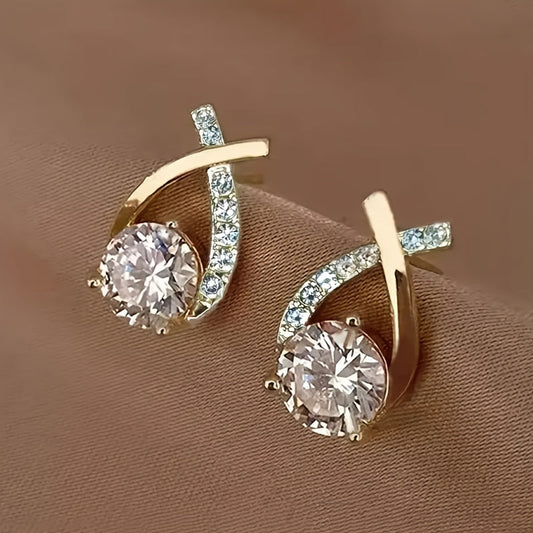 Iris · Pendientes de cruz con circonitas – Silvia Morel